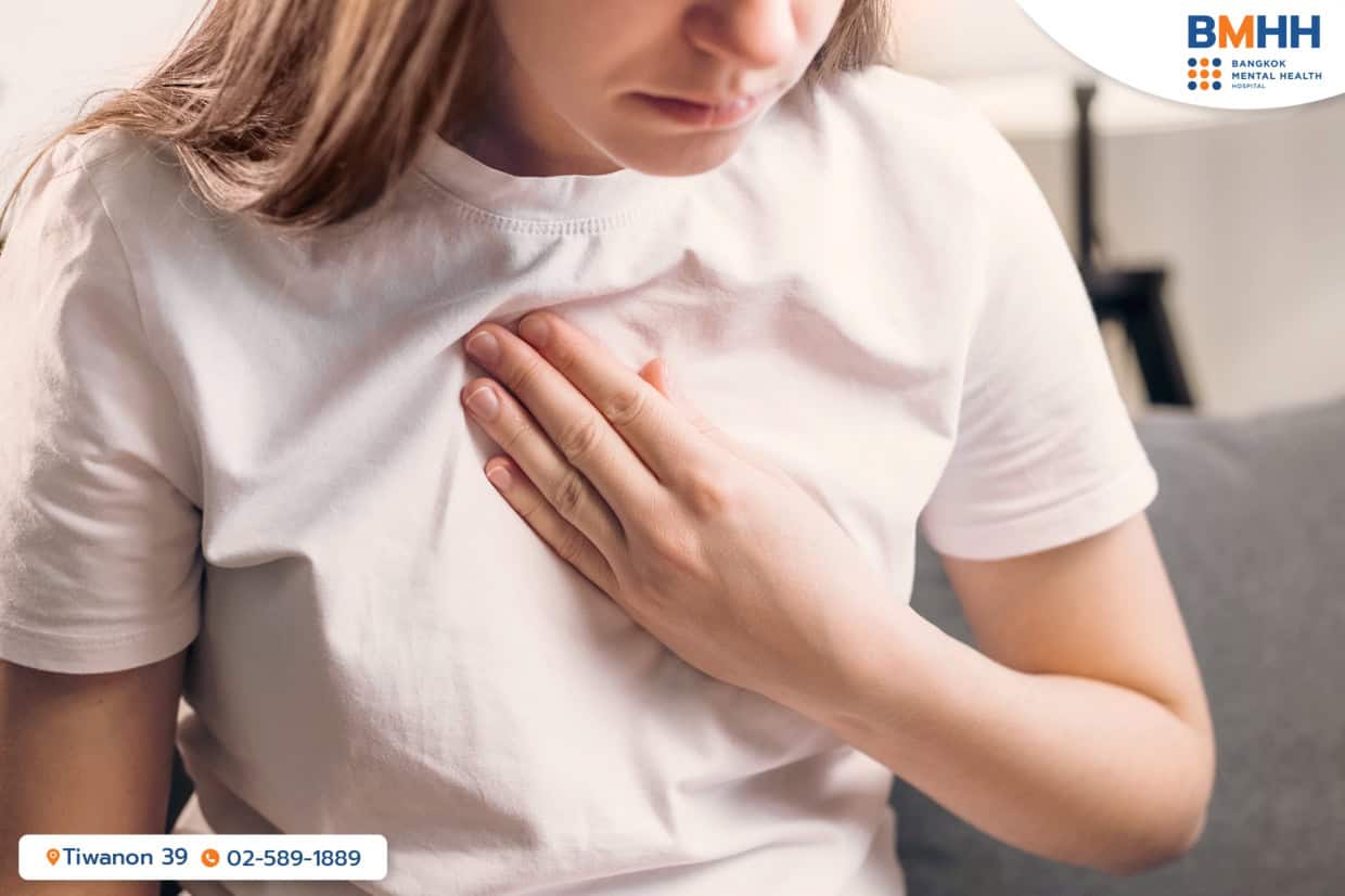 A woman trying to calm down from a panic attack